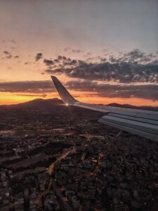 A stunning aerial view of Thessaloniki, Greece, captured from an airplane during sunset.
