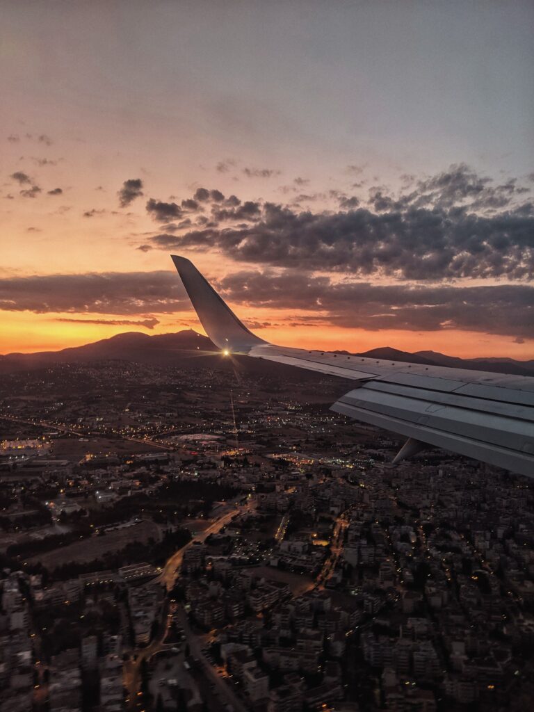 A stunning aerial view of Thessaloniki, Greece, captured from an airplane during sunset.